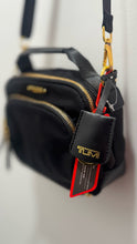 Load image into Gallery viewer, TUMI Black Nylon gold hardware Size crossbody Small Purse
